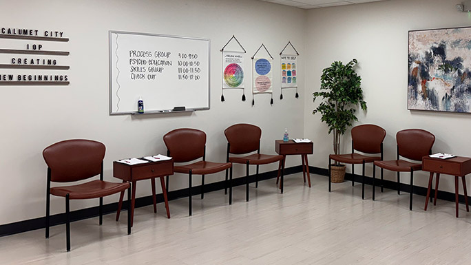 An outpatient behavioral health therapy space with chairs arranged for group therapy