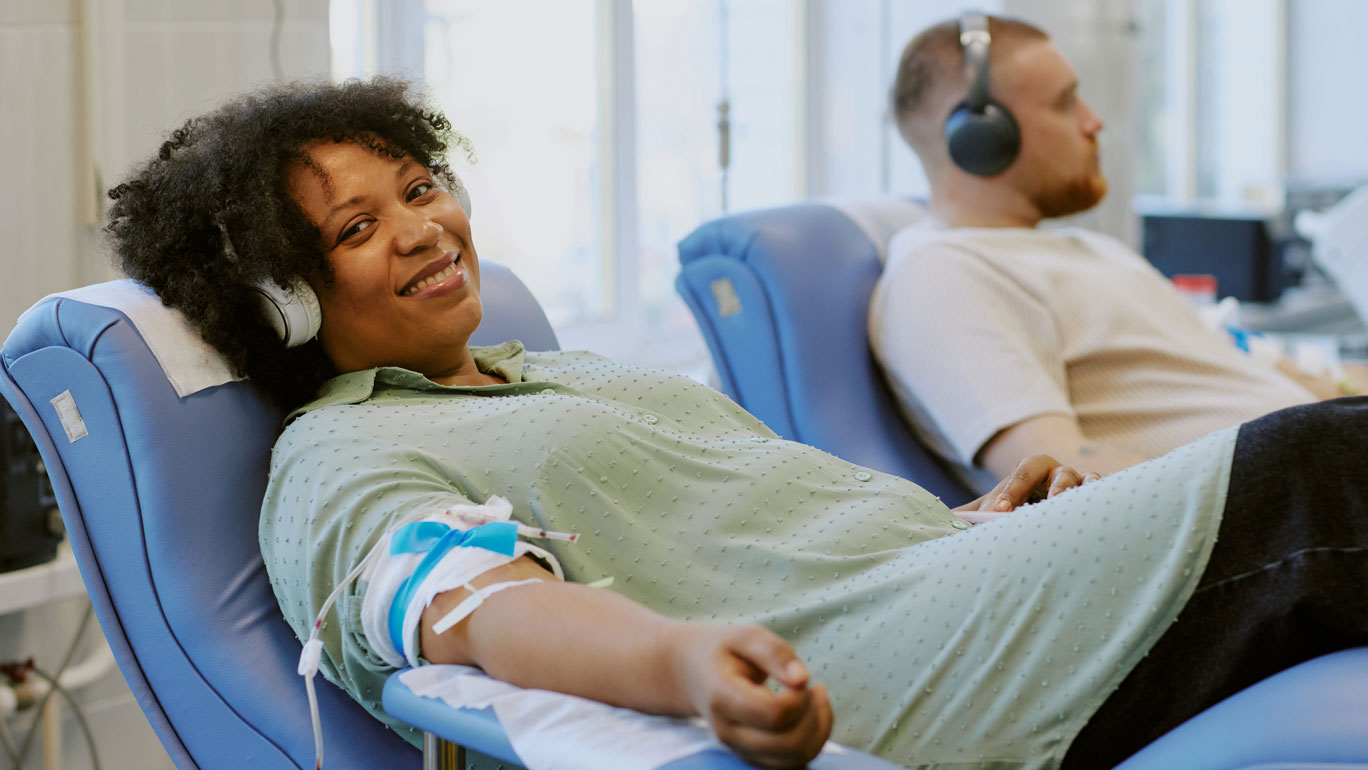 Woman and man donating blood