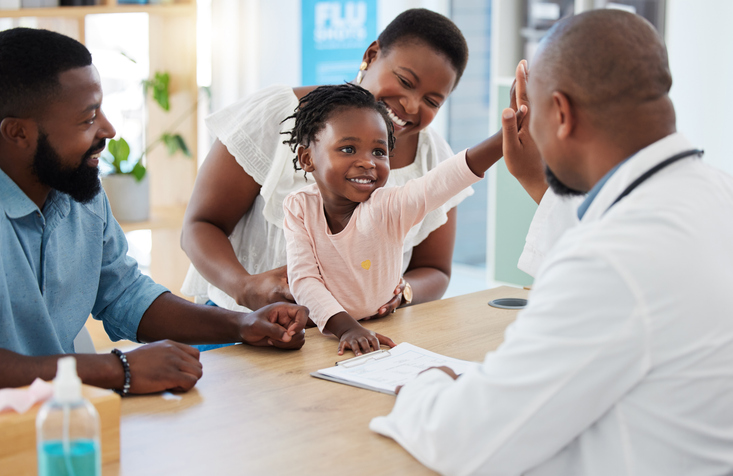 child and family consulting with doctor