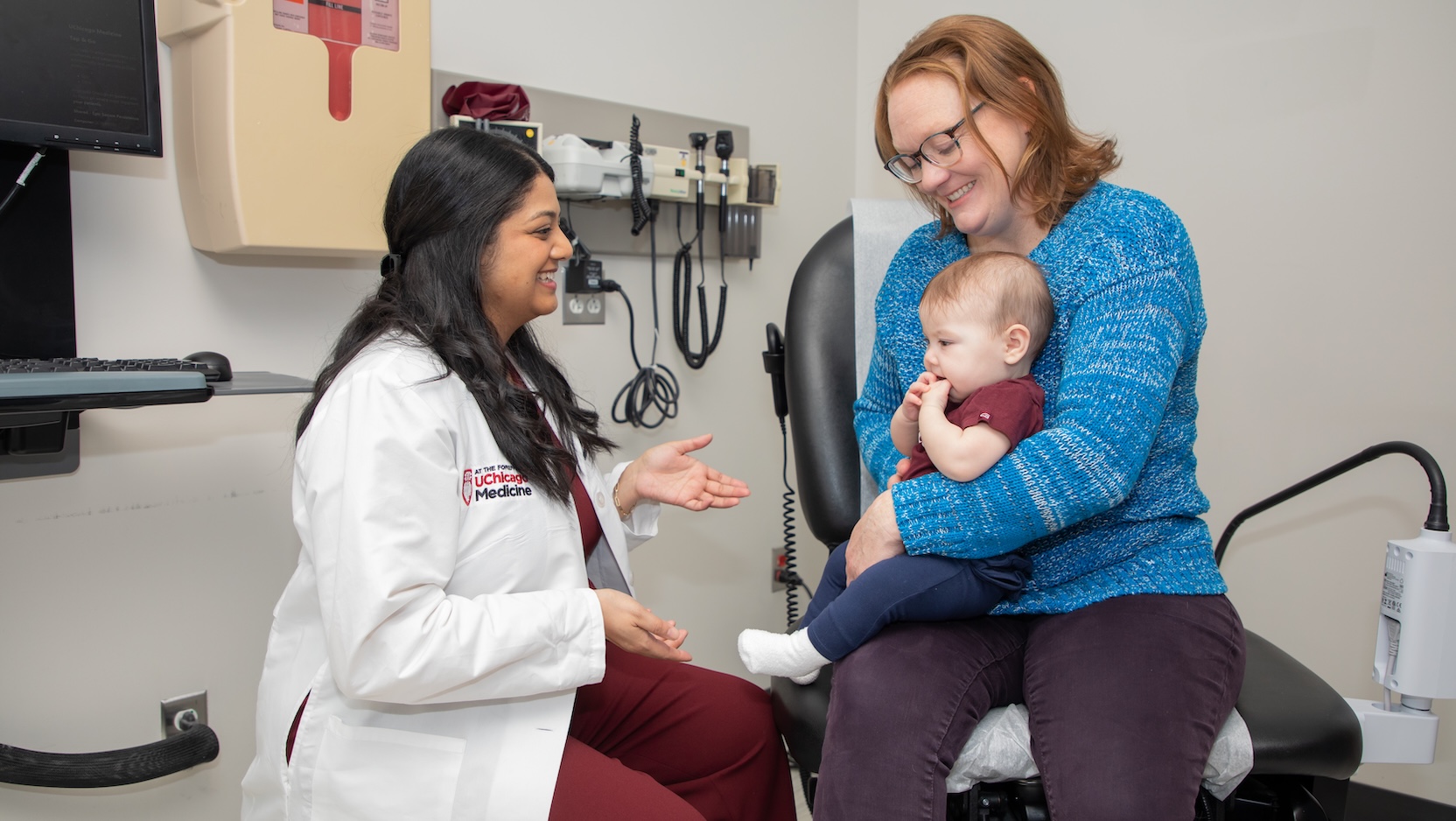 Dr. Pradhan meets with infant patient and mother