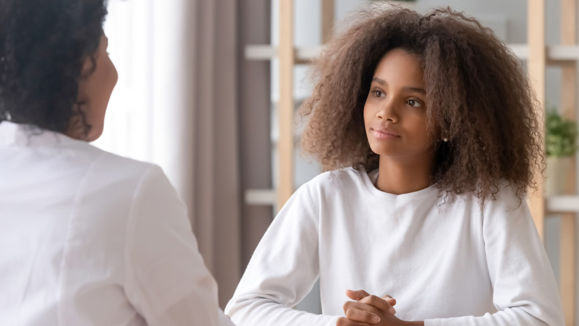 Pediatric patient talking to a doctor about pediatric fertility preservation