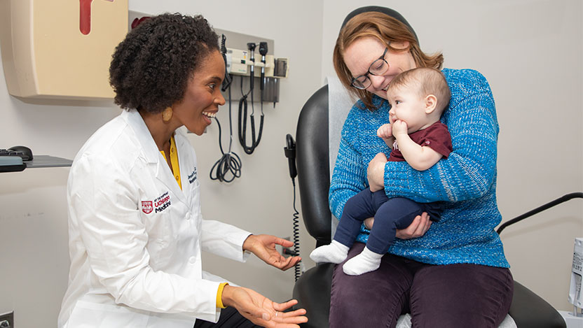 Image of Dr. Jessica Long working with a pediatric patient