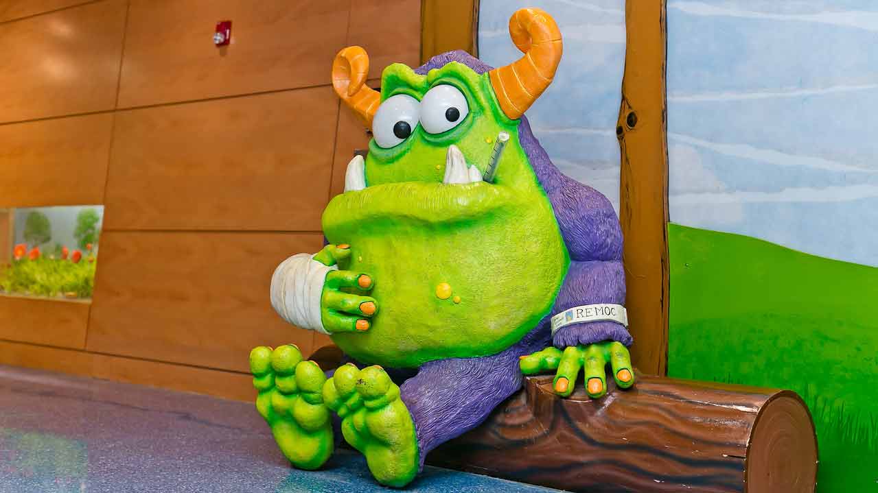 Remoc, Comer Children's Hospital's friendly monster mascot, sits in the hospital lobby.