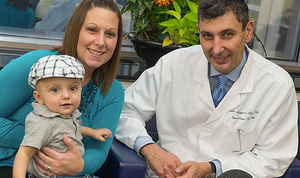 Jennifer Zinga with gynecologic oncologist Dr. Ernst Lengyel and son Rocco, born after cervical cancer treatment