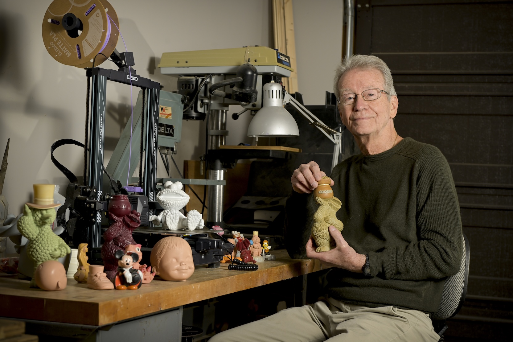 John Balogh with toys he designed