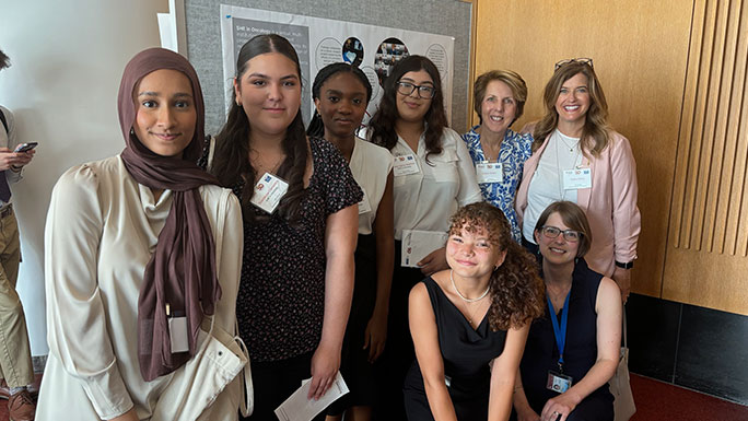 Guadalupe Camarena (second from left) with SHE colleagues and program leadership at the UCCCC 10th Annual Summer Research Symposium.