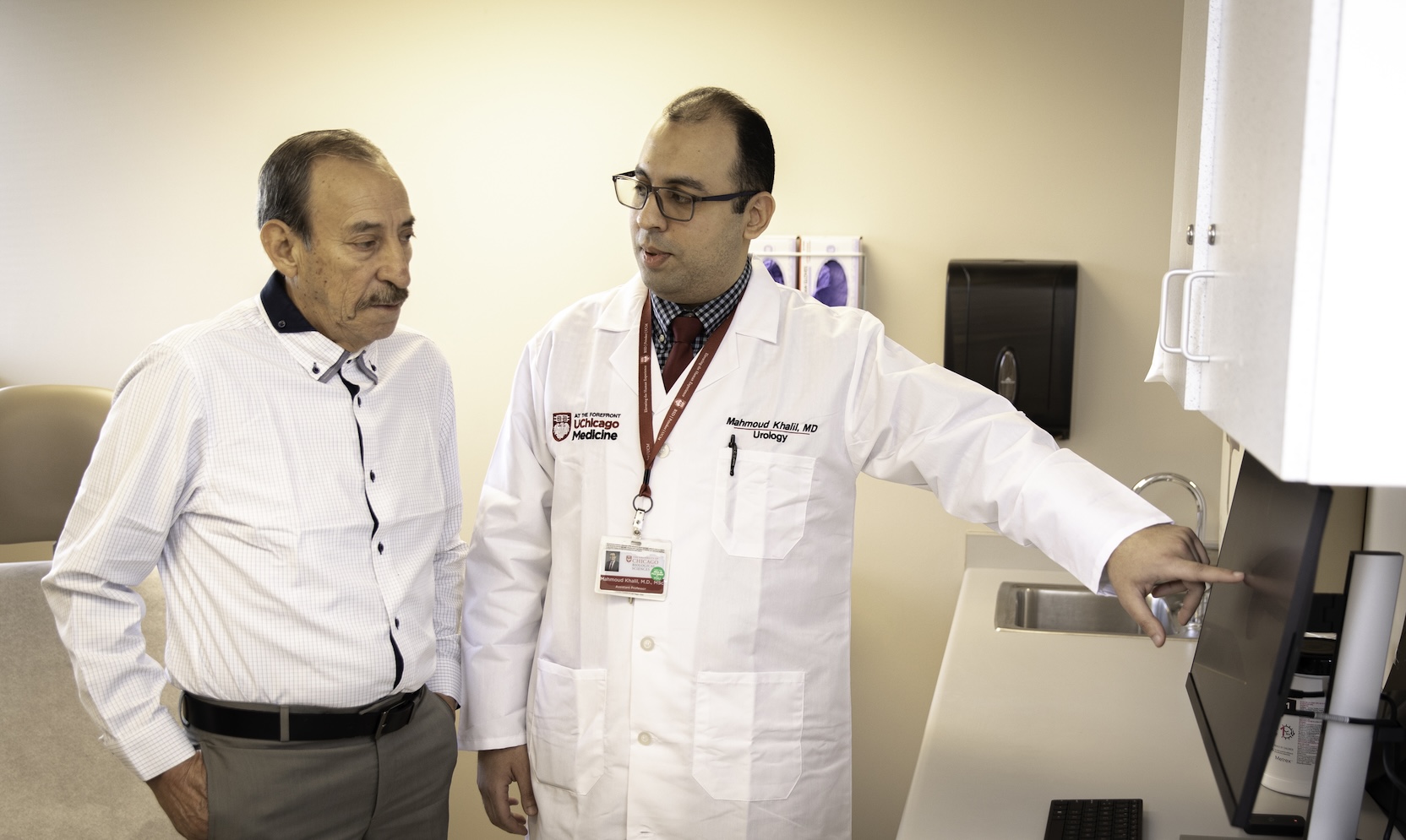 Mahmoud Khalil, MBBCh, consults with a patient.