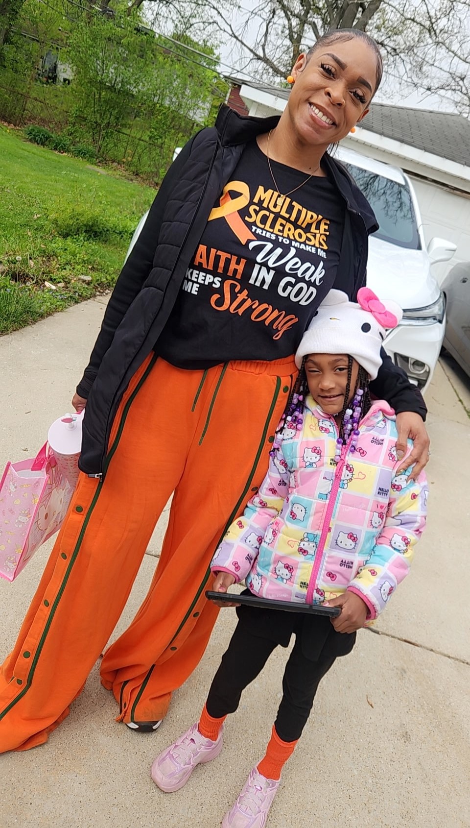Porscha Lacey-Johnson, of Park Forest, who has multiple sclerosis (MS), poses with her 5-year-old daughter, Paige.