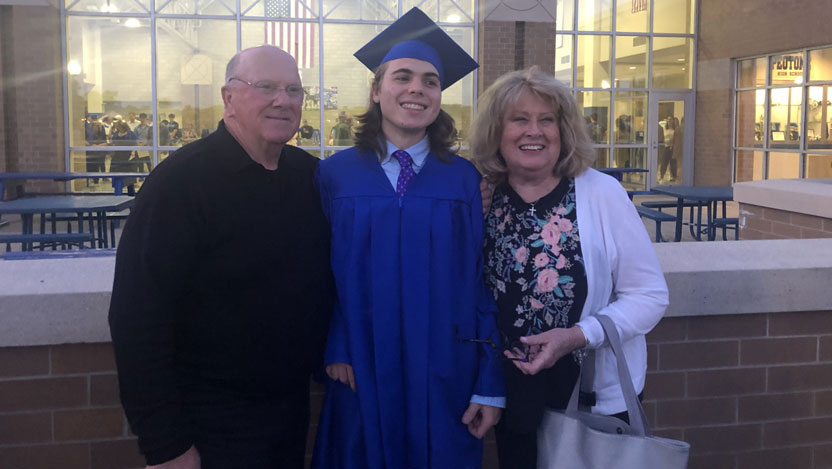 Thor Marchio with his parents at high school graduation