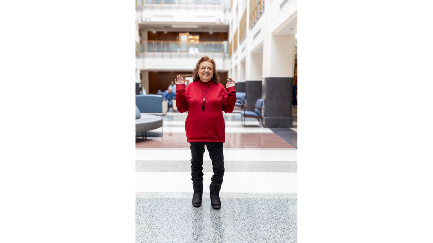 Luz Graciela Gamero, a Hyde Park resident, is all smiles as she walks on her new 