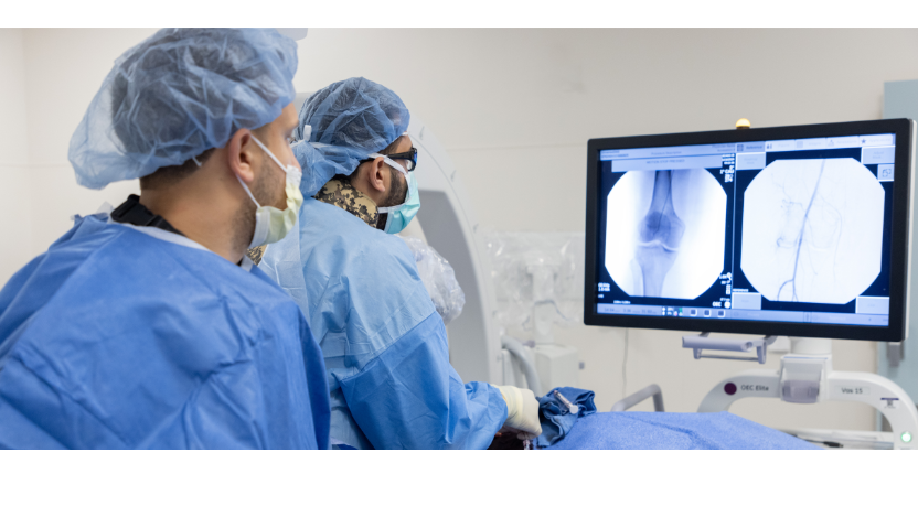 Osman Ahmed, MD, studies a knee X-rays before performing surgery at the University of Chicago Medical Center in Hyde Park.