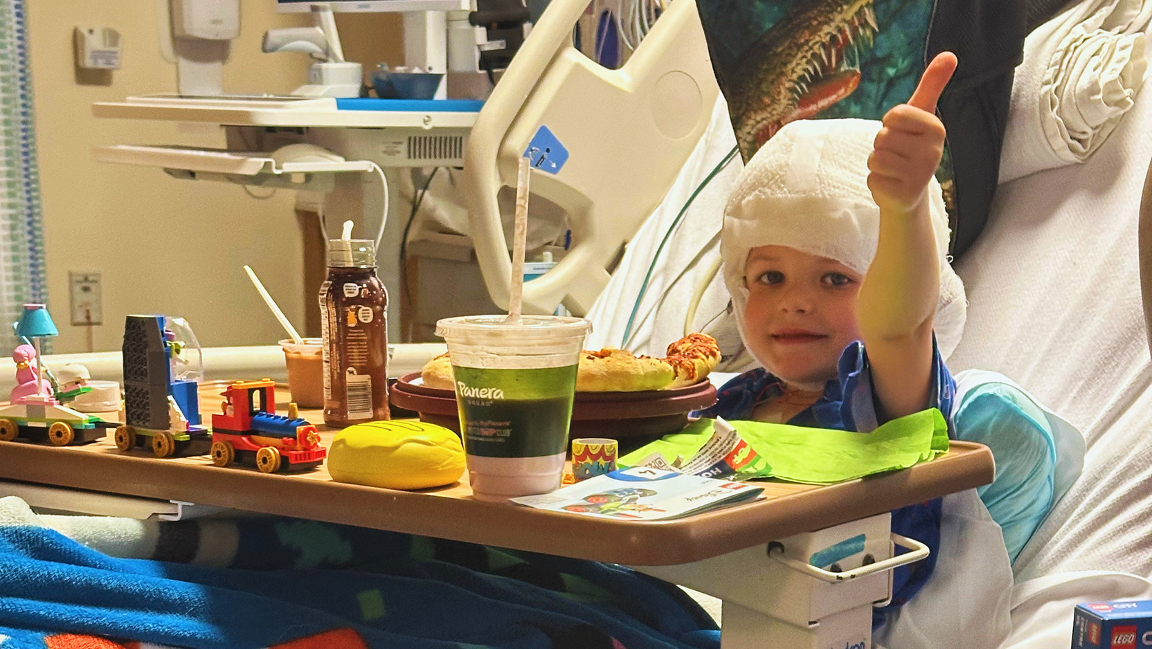 Brad Fisher giving thumbs up in the hospital