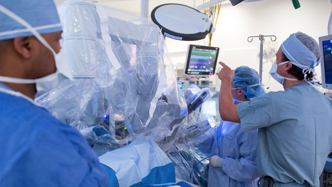 Urologist Scott Eggener, MD, and team in robotic surgery