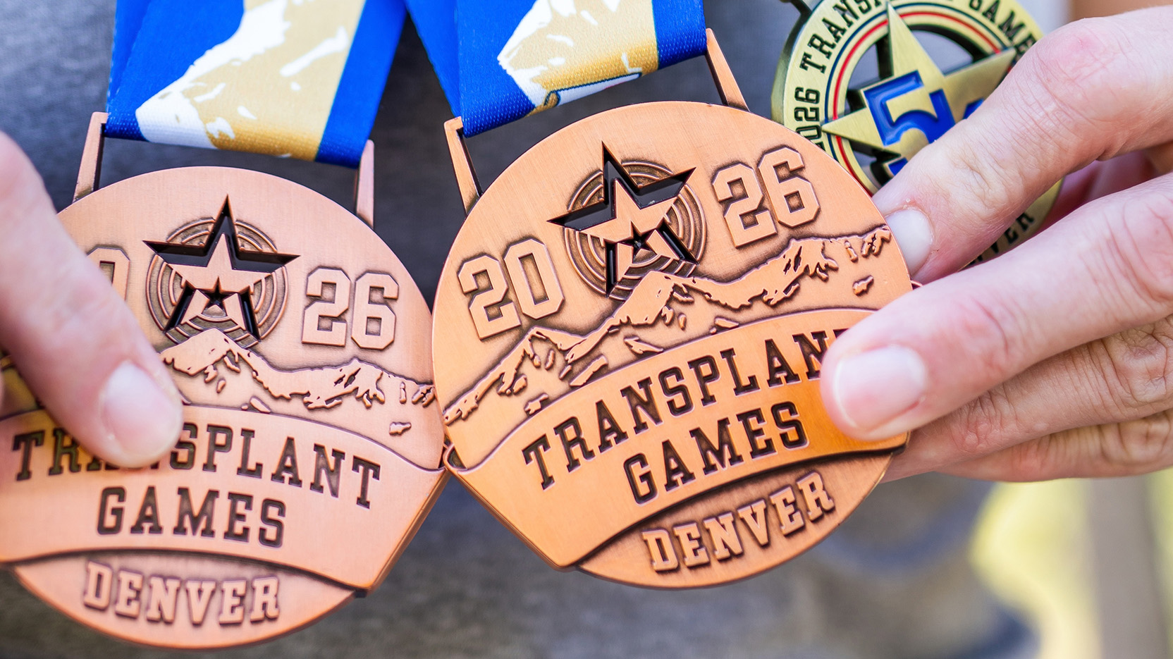 Transplant patient Elizabeth Sullivan holding medals