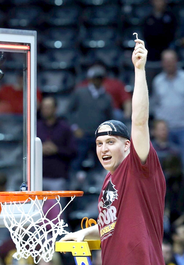 Nick DiNardi cutting down the net