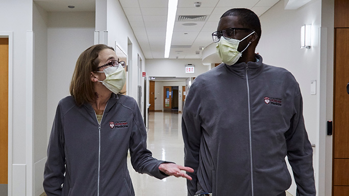 Sarah and Daru recovering together after triple organ transplant surgery at UChicago Medicine