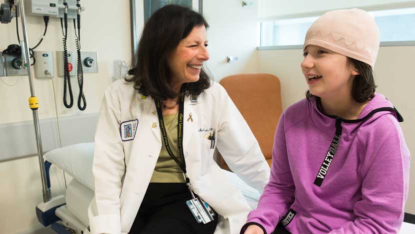 Dr. Susan Cohn working with a pediatric neuroblastoma patient