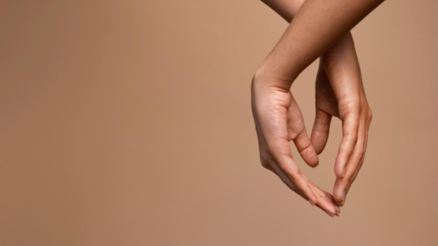 A person’s hands delicately posed to highlight healthy joint function and flexibility