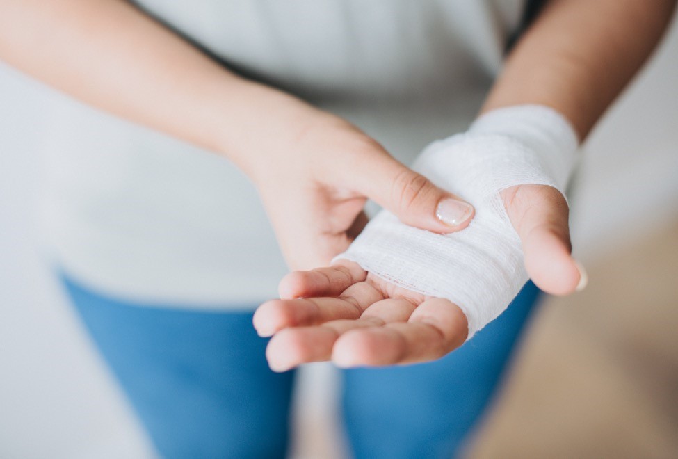A hand wrapped in a bandage.