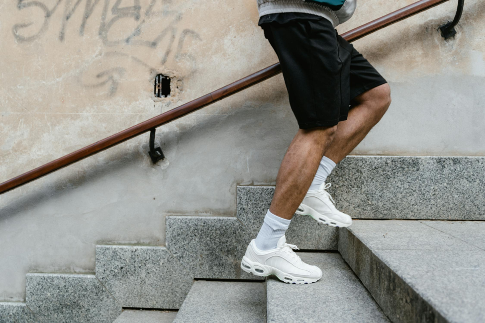 A man improving foot health by exercising on stairs. 