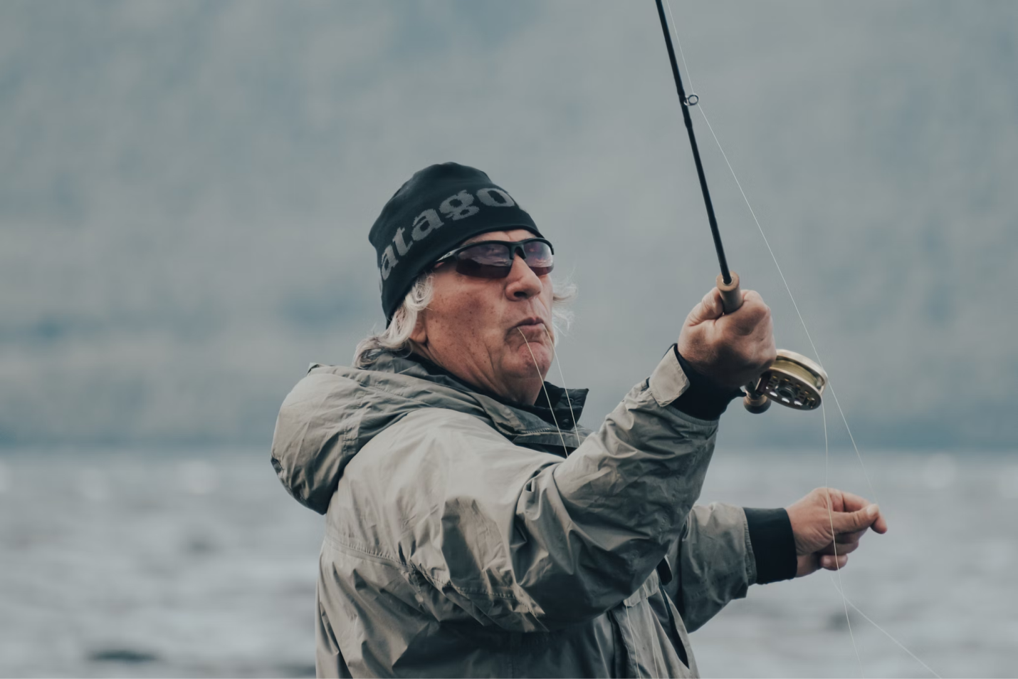 A man with a fully functional elbow enjoys fishing.