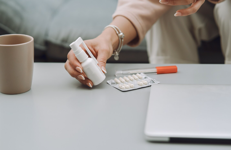 A patient organizing postoperative medications while preparing for recovery at home after outpatient surgery.