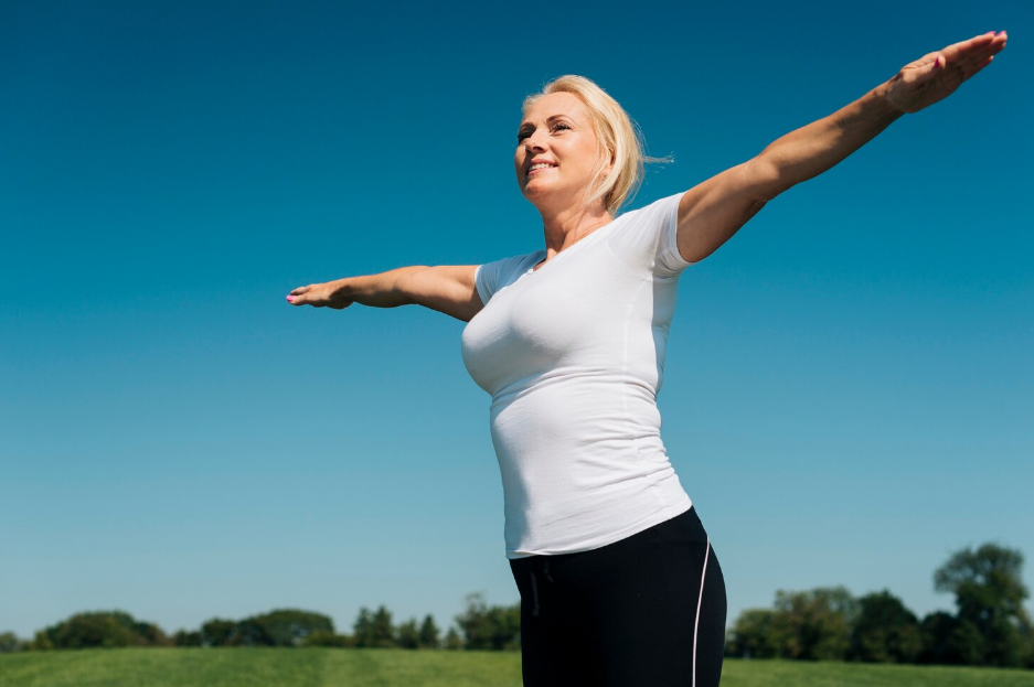A woman exercising outdoors.