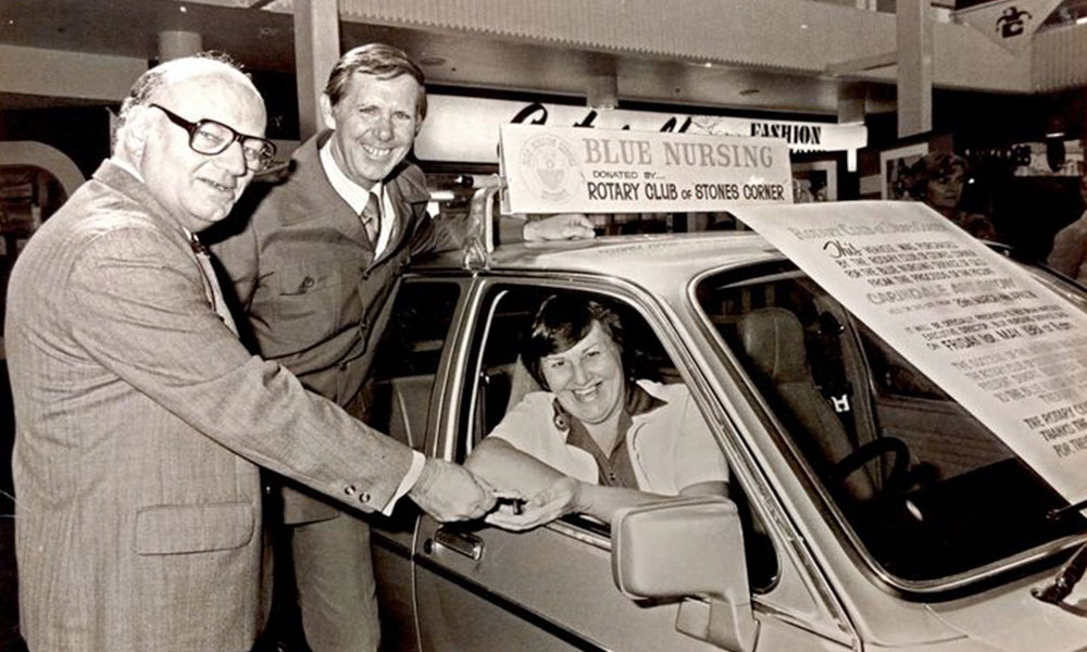 Historic image of the first car for the Blue Nursing Service, a second-hand Hillman, donated by Redman Motors on Christmas Eve