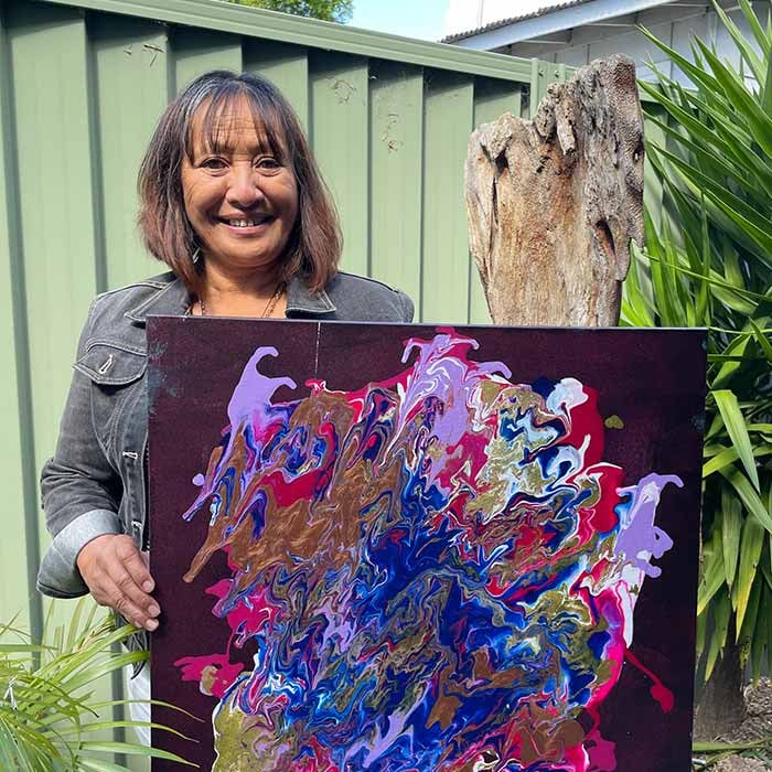 Pauline holding her painting