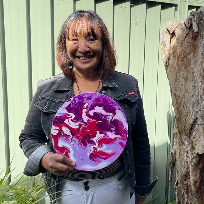 Pauline holding her painting
