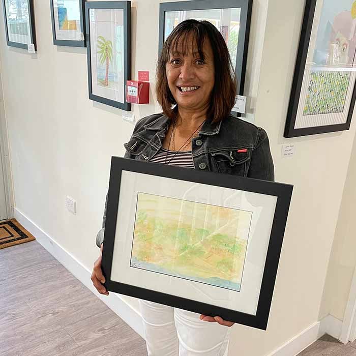 Pauline holding her painting
