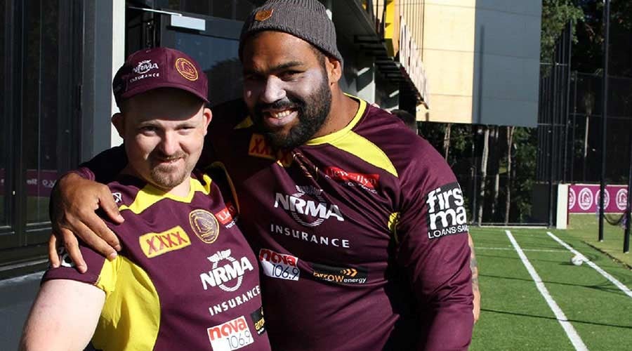 two men with Brisbane Broncos t-shirts
