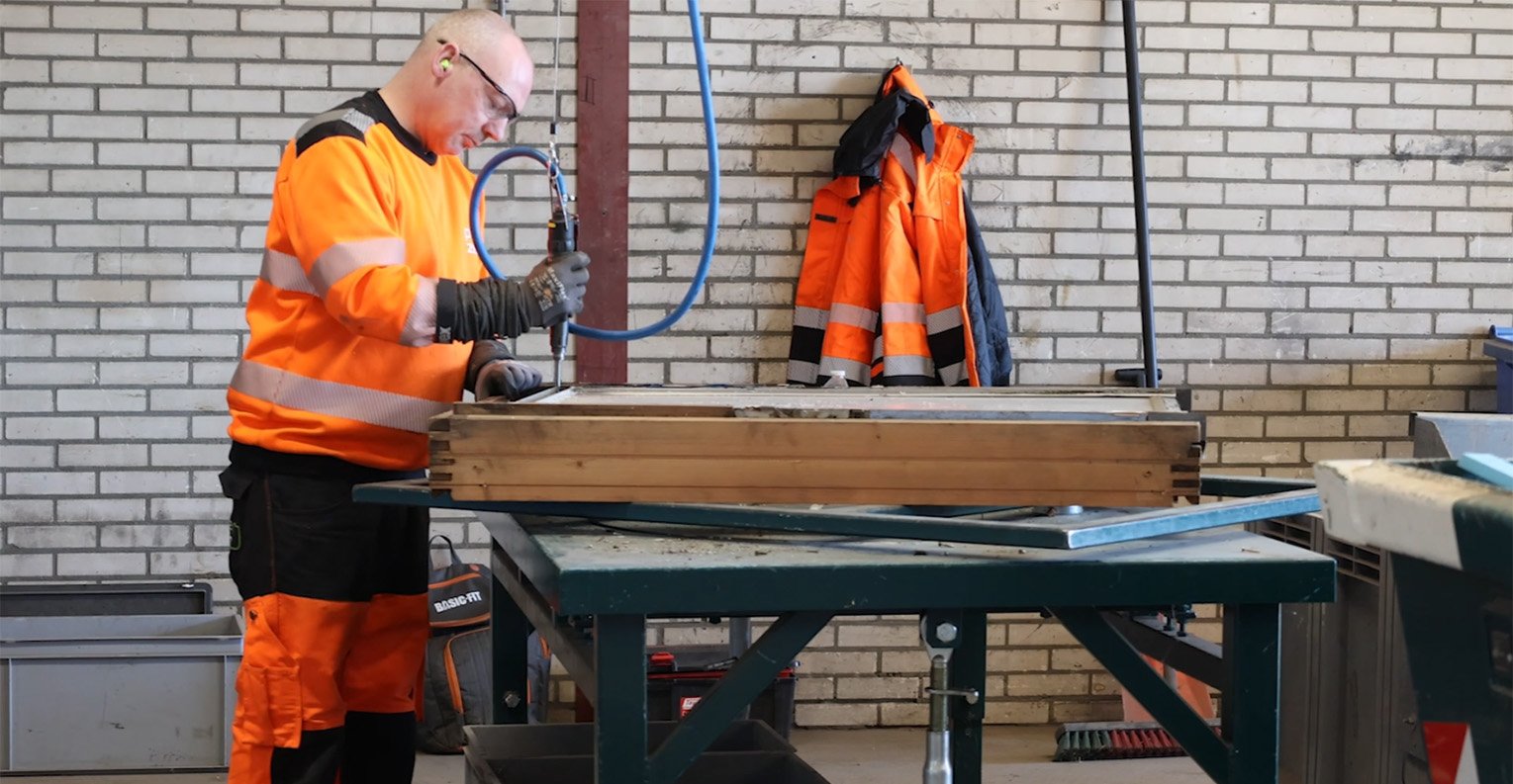 man fixing window circularity