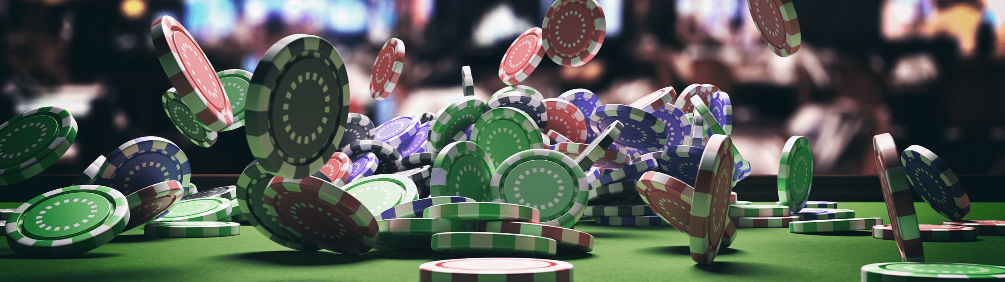 A vibrant and dynamic image showcasing an assortment of playing cards scattered with casino chips, each chip marked with different values, capturing the exciting atmosphere of a casino