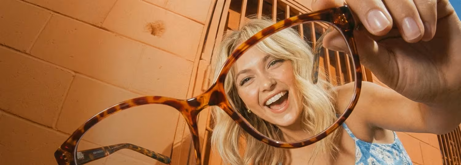 Woman wearing glasses and smiling