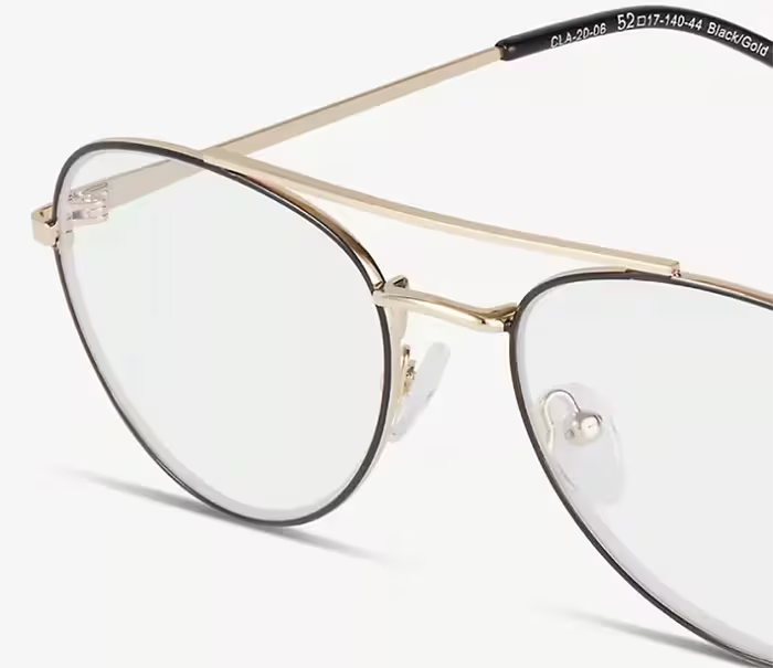 Close-up of black and gold aviator frames