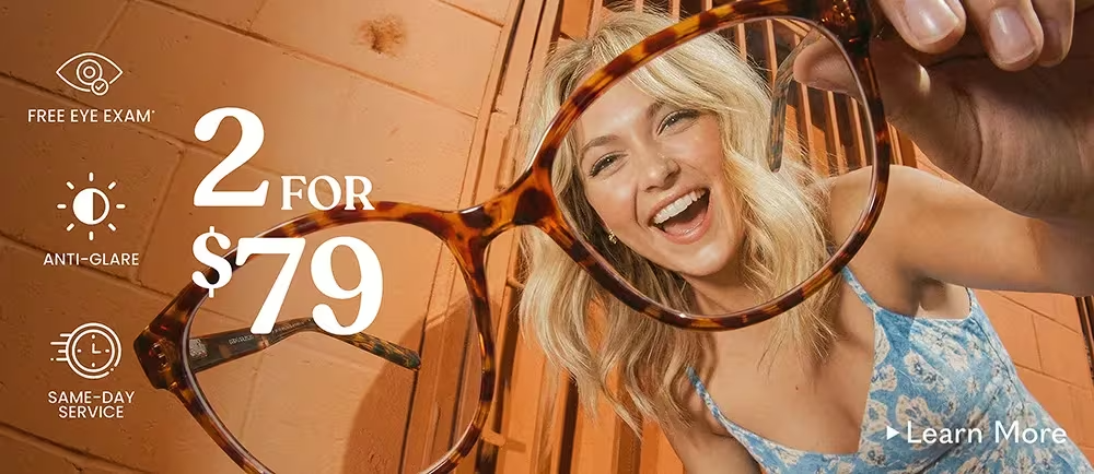 Smiling woman holding tortoiseshell eyeglasses toward the camera, promoting a 2 pairs of glasses for $79 offer with free eye exam, anti-glare lenses, and same-day service.