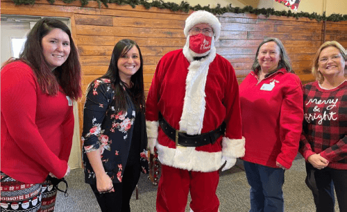 Members of the Perry’s Women in Nuclear (WiN) take a Christmas photo