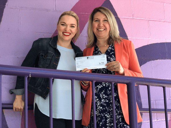 Energy Harbor and ACCESS representatives holding check