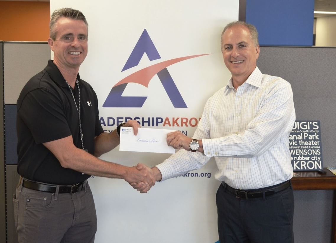 image of Energy Harbor presenting a $10,000 check to Leadership Akron