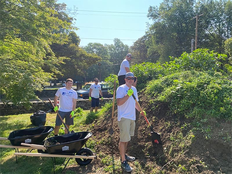 Energy harbor finance team working outside to help protect akron history site