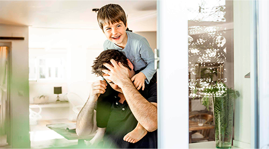 Father playing with son on his shoulders