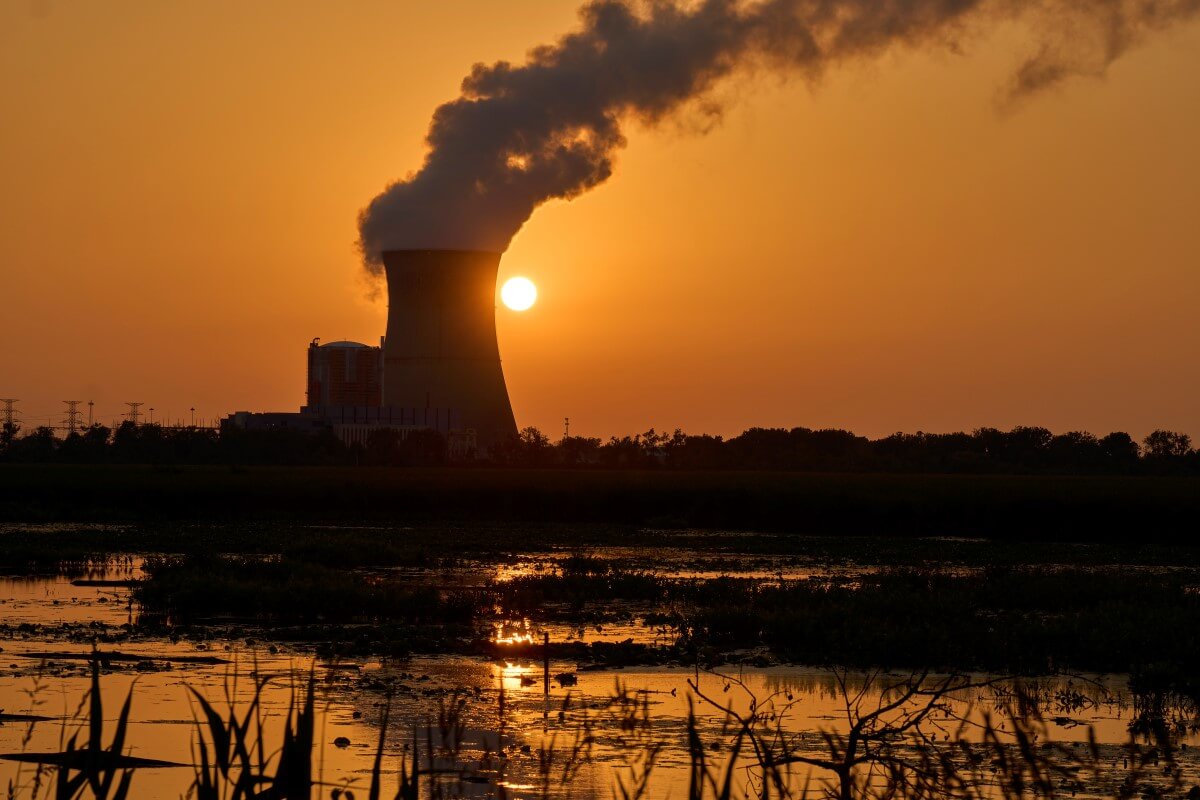 Silhouette of Energy Harbor’s Perry nuclear plant at sunset