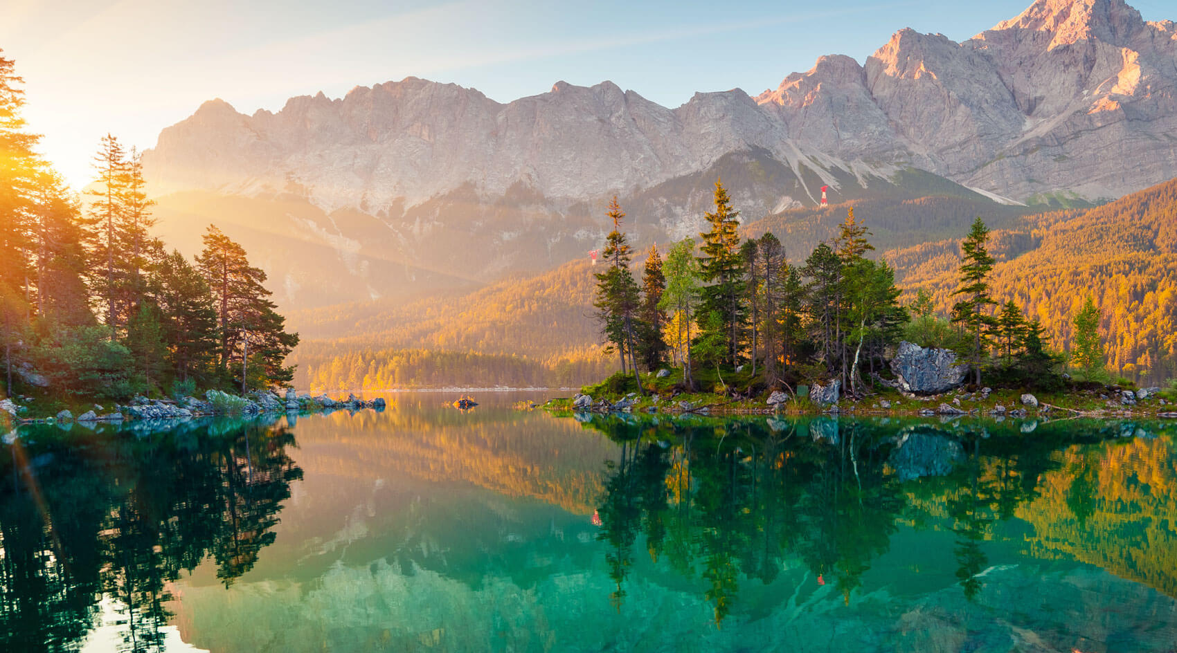 A picturesque view of a lake at dawn.