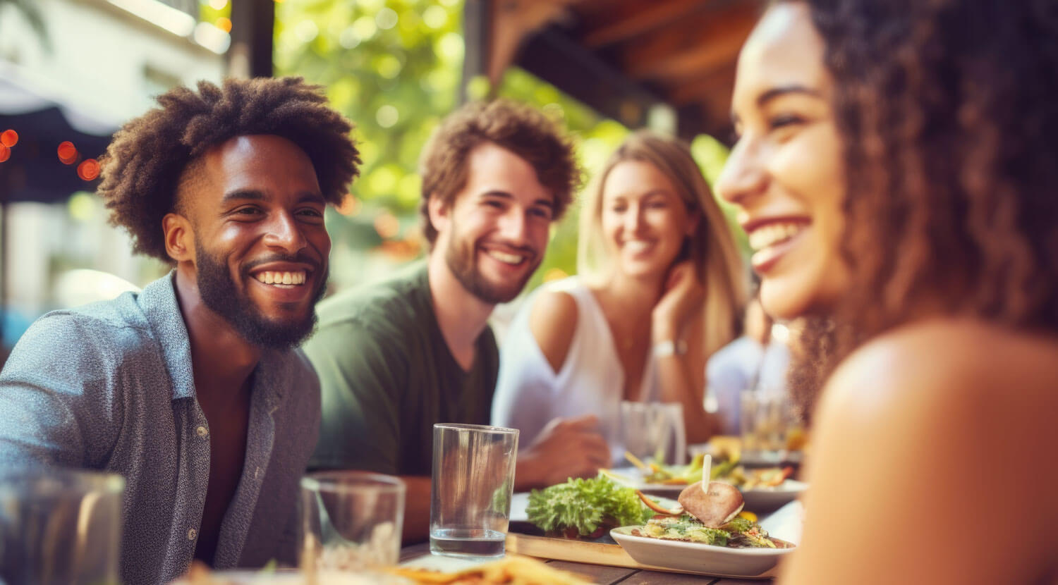 A group of friends gathered for dinner outdoors.