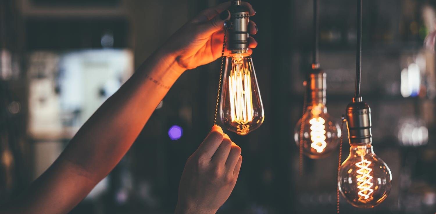 A person changes a light bulb