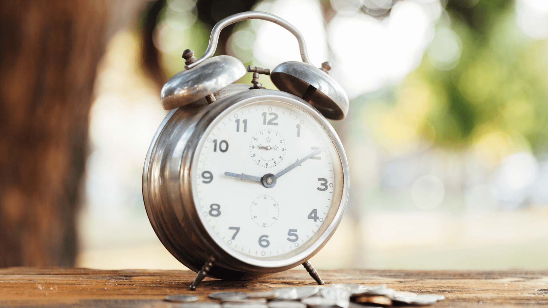 Old alarm clock with hands at 9 and 2