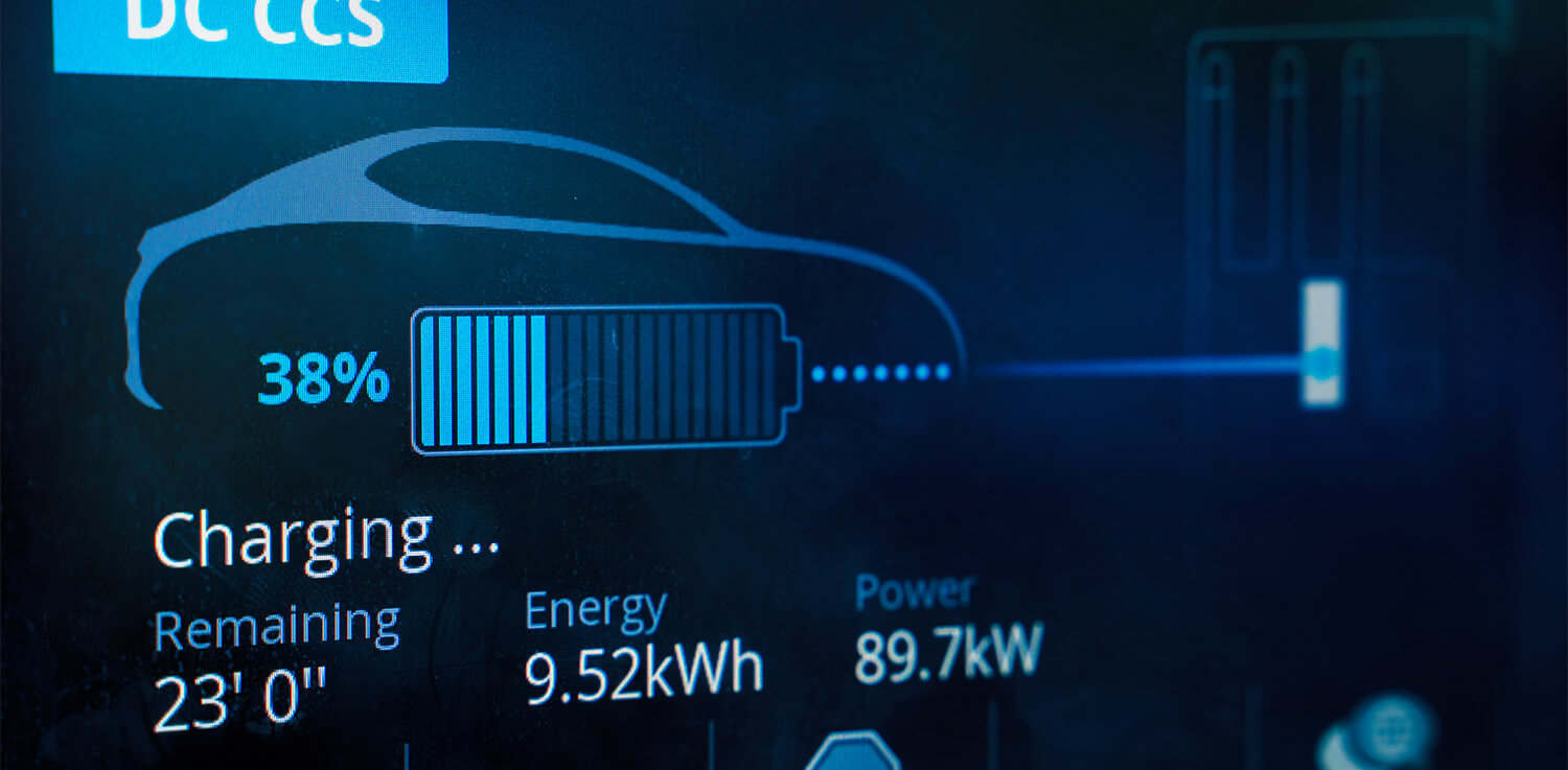 A digital display shows the battery charge percentage for an electric vehicle.