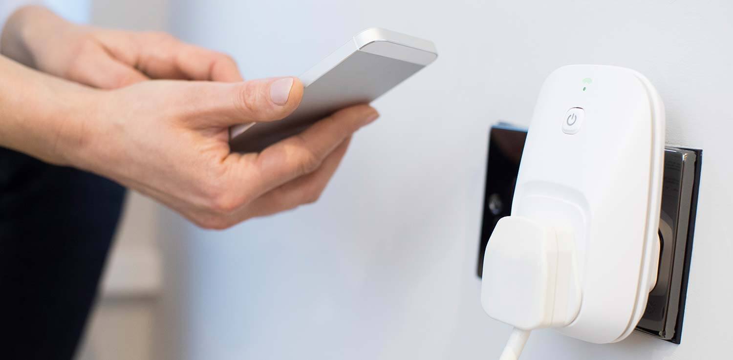 Man using a smart power strip