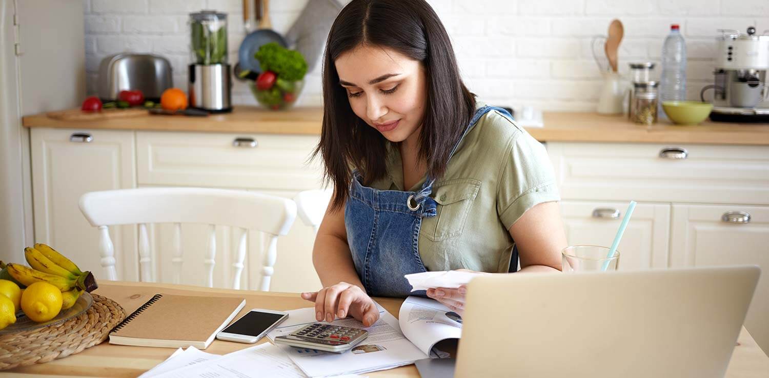 Woman figuring out how to lower her energy bill
